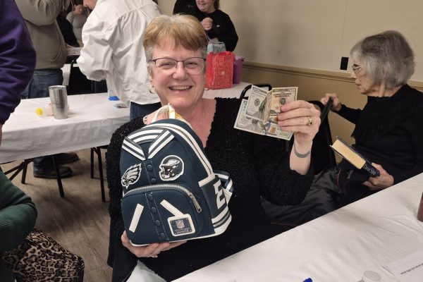 Happy winner, Dana. An Eagles designer bag with $150 cash inside!